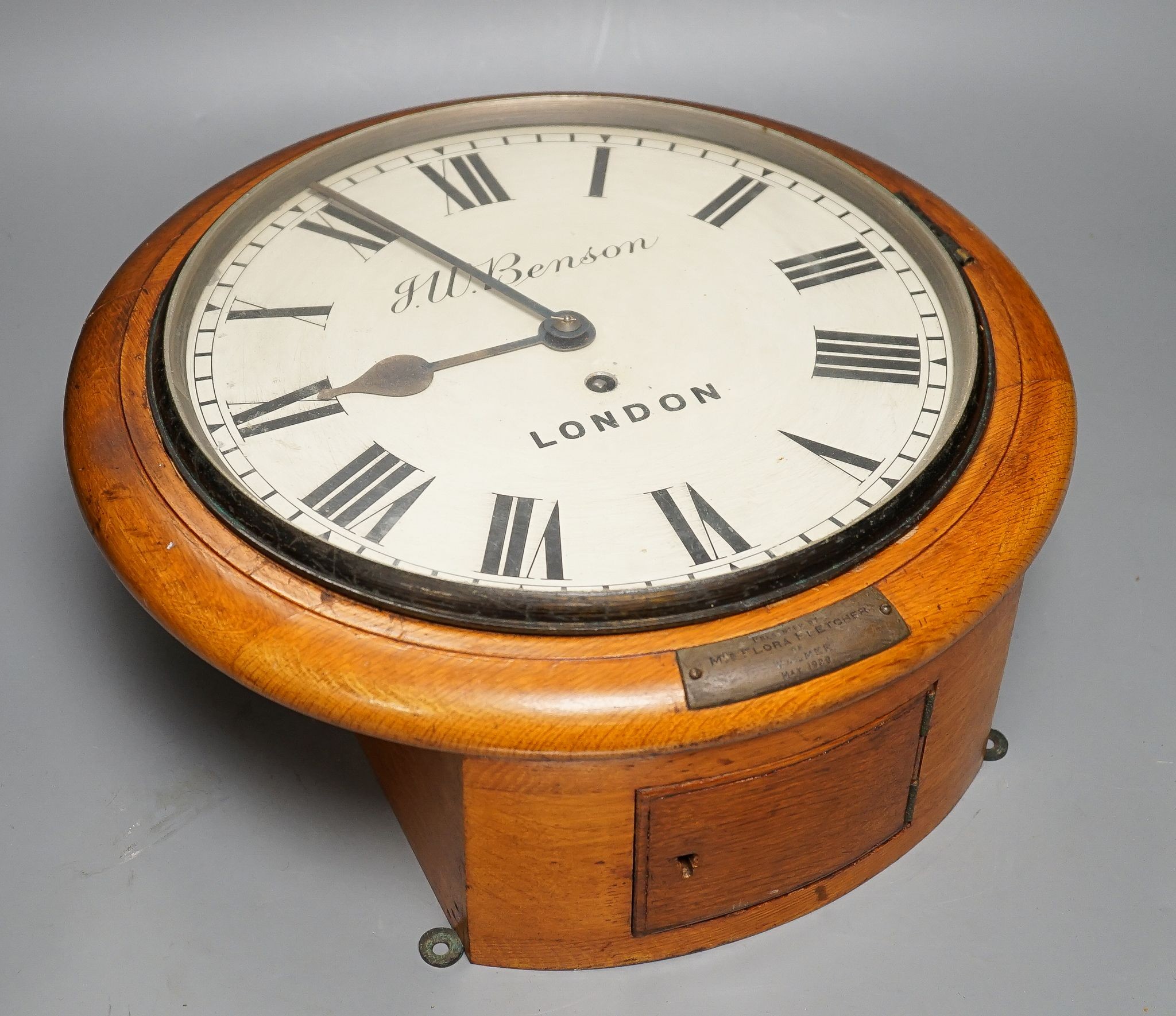 A Victorian oak-cased dial clock, signed JW Benson, London, 38 cms diameter.